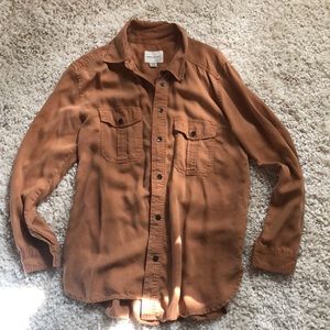 Cute button top but never wear !